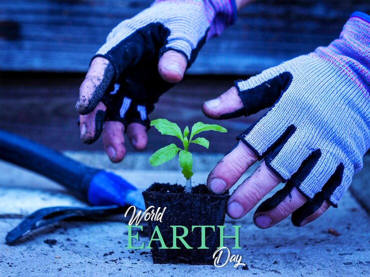 PSD a hand holding a tree that says earth day day day day