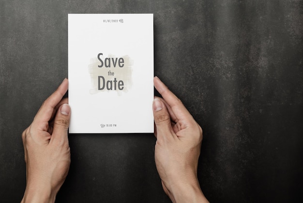 PSD hand holding wedding invitation card mockup, visit card template.