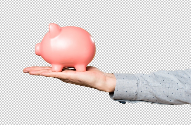 Hand of man holding holding a piggybank