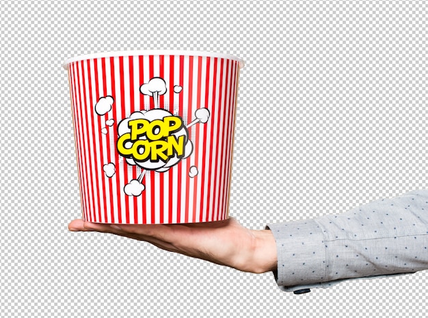 Mano dell'uomo che tiene la scatola di popcorn