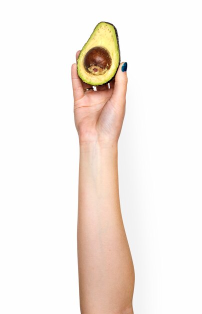 hand met avocado