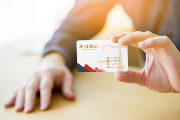 PSD hand presenting business card mockup