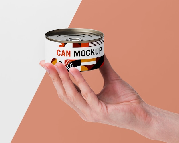 Hand with tin can