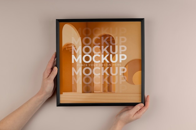 Handen met donker frame mockup bovenaanzicht