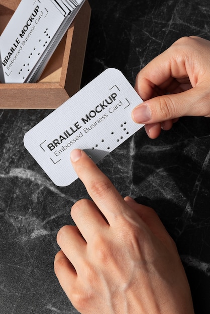 PSD hands holding business card