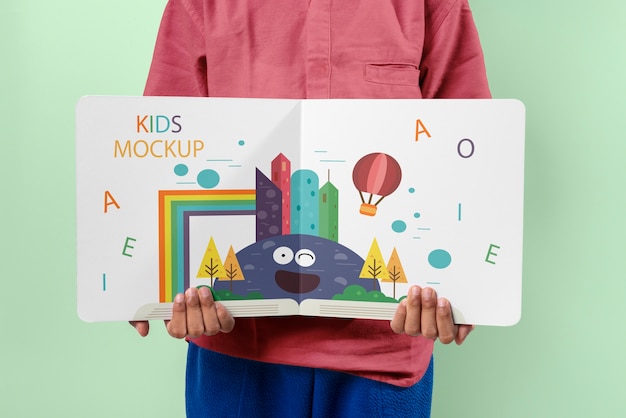 PSD hands holding children book mockup