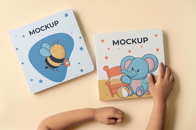 Hands holding children book mockup