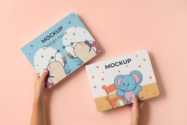 PSD hands holding children book mockup