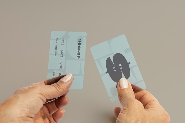 Hands holding credit cards in studio