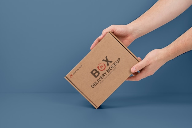 Hands holding mailing box mockup