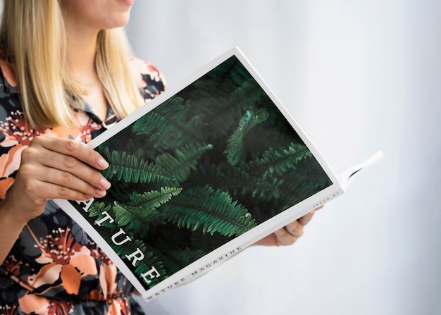 PSD hands holding a nature mock up magazine