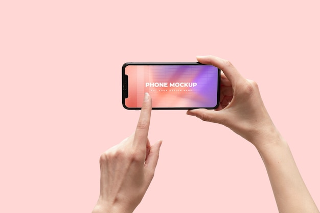 PSD hands holding smartphone device mock-up on color background