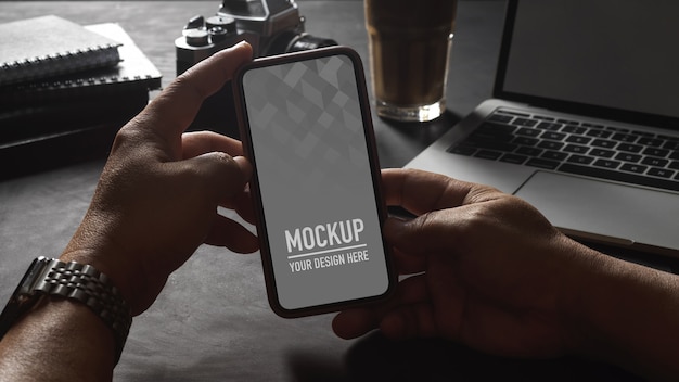 Hands holding smartphone screen mockup