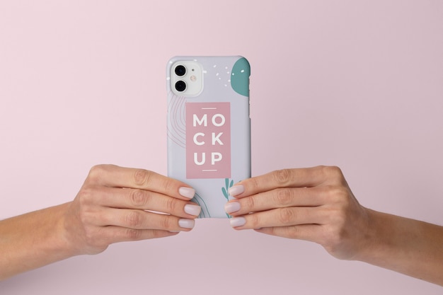 PSD hands holding smartphone with mock-up phone case