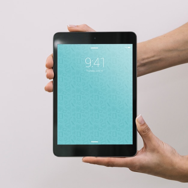 hands holding tablet mockup