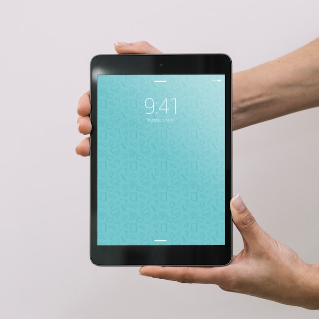 Hands holding tablet mockup