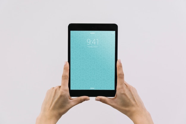 Hands holding tablet mockup