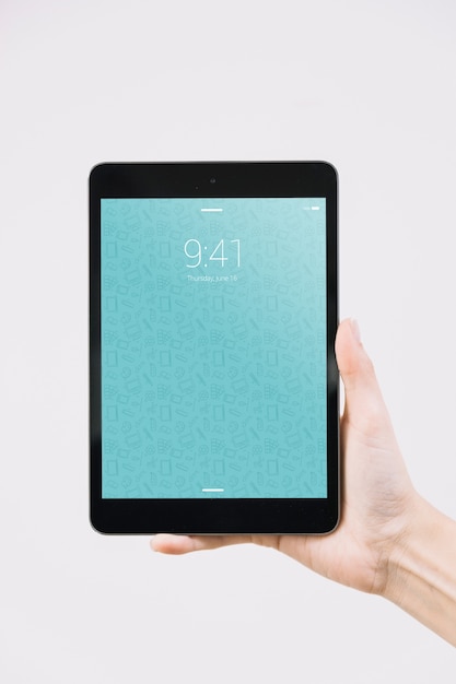 hands holding tablet mockup