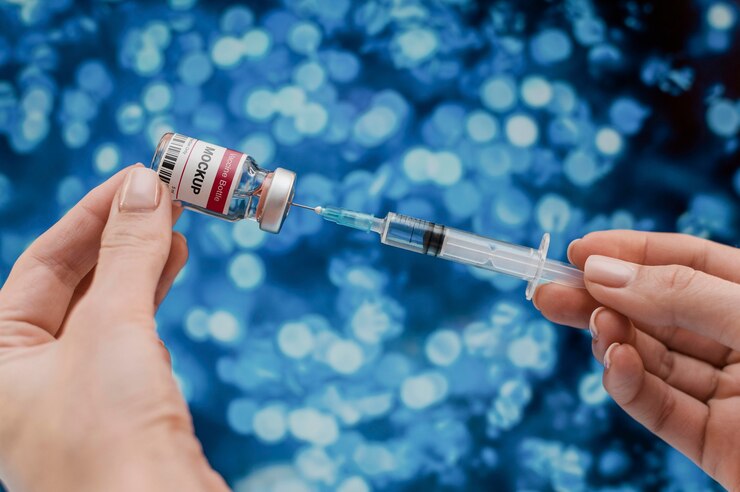 PSD hands holding vial and injection close up