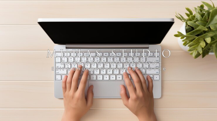 PSD hands typing on a laptop on a wooden table