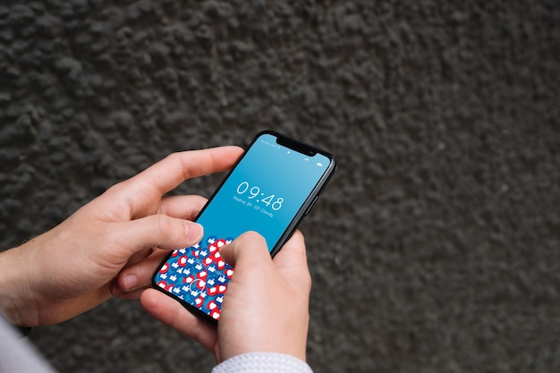 Hands using smartphone mockup