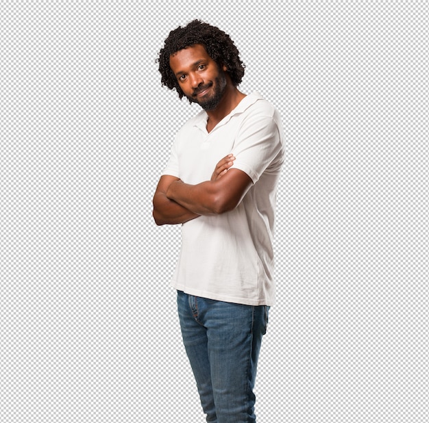 handsome african american crossing his arms, smiling and happy, being confident and friendly
