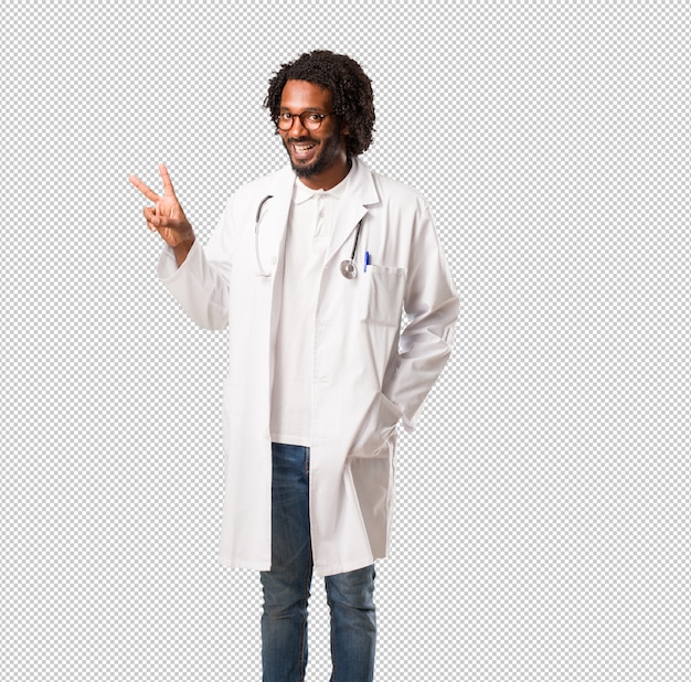 PSD handsome african american medical doctor fun and happy, positive and natural, makes a gesture of victory, peace concept