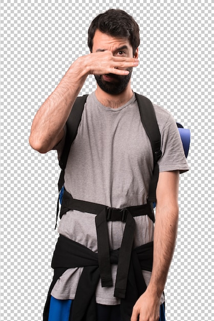 PSD handsome backpacker making smelling bad gesture