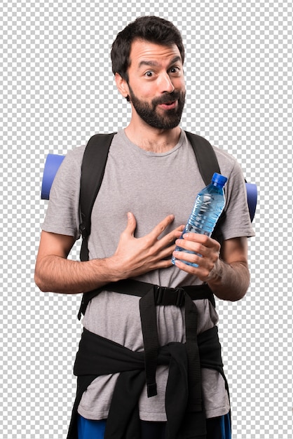 Handsome backpacker with a bottle of water