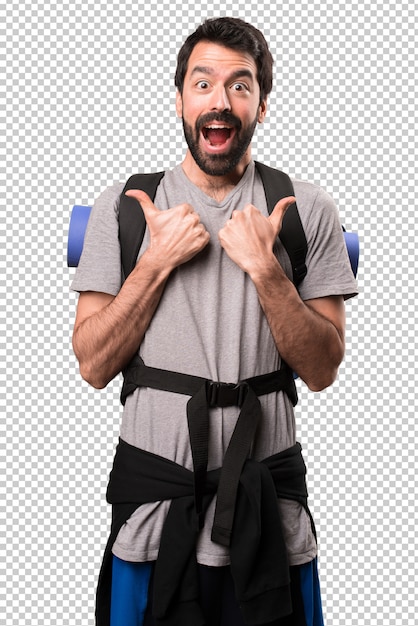 Handsome backpacker with thumb up