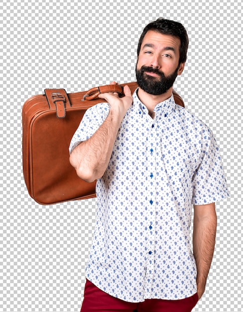 Handsome brunette man with beard holding a vintage  briefcase