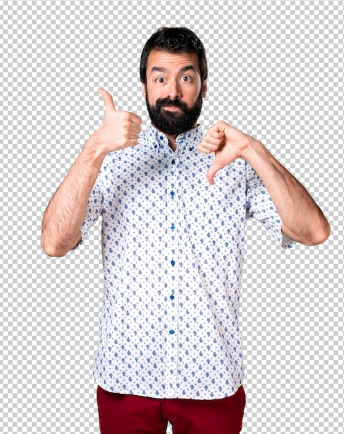 Handsome brunette man with beard making good-bad sign