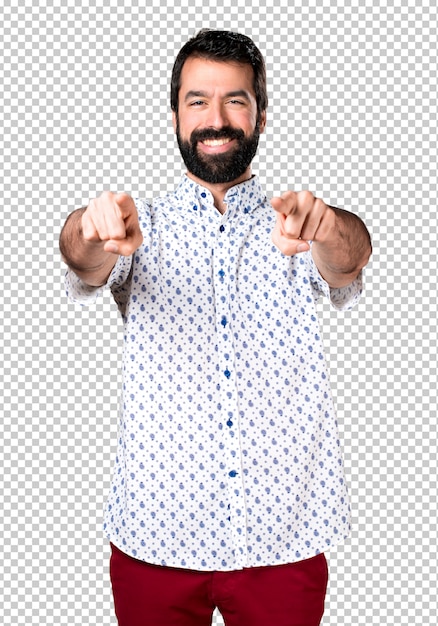 Handsome brunette man with beard pointing to the front