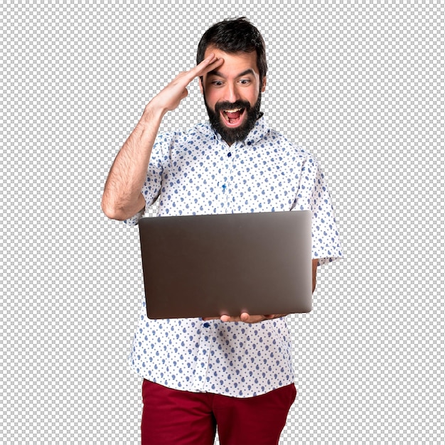 Handsome brunette man with beard with laptop