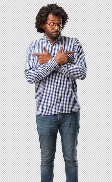 handsome business african american man confused and doubtful man, decide between two options, concept of indecision