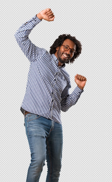 PSD handsome business african american man listening to music, dancing and having fun, moving