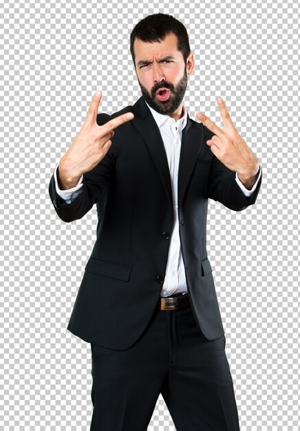 PSD handsome businessman making victory gesture