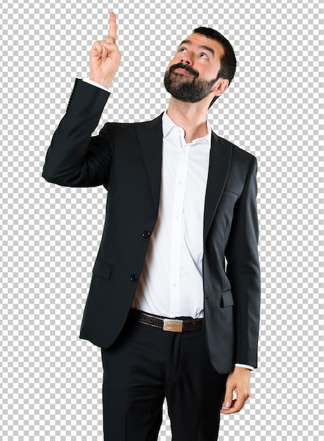 Handsome businessman pointing up