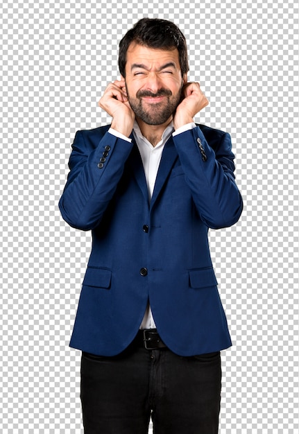 Handsome man covering his ears