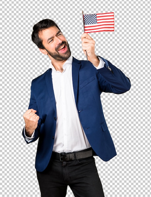 Handsome man holding an american flag