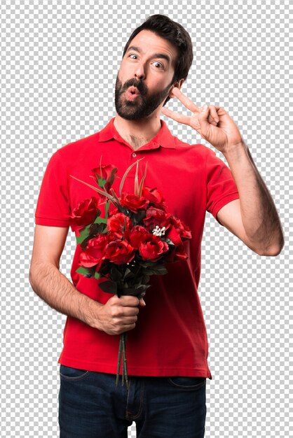 PSD handsome man holding flowers making victory gesture