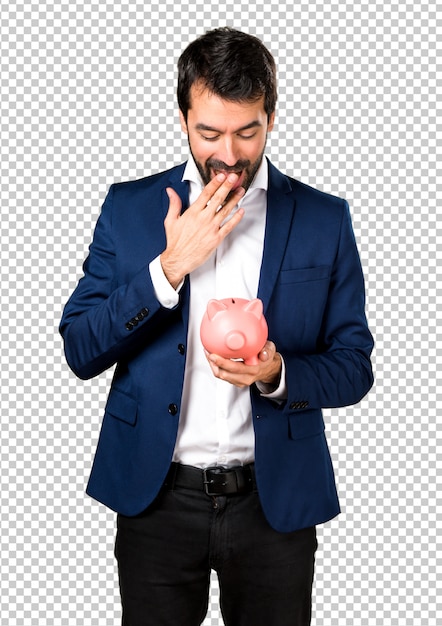 PSD handsome man holding a piggybank