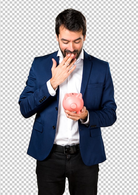 PSD uomo bello che tiene un piggybank