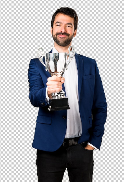 Handsome man holding a trophy