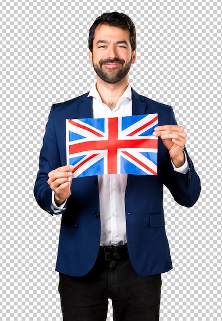 Handsome man holding an uk flag