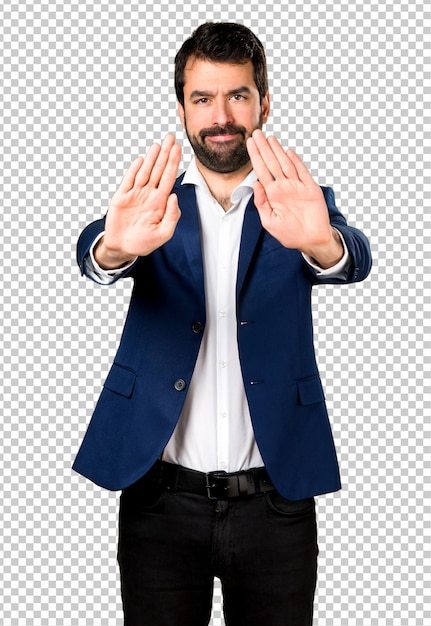 Handsome man making stop sign