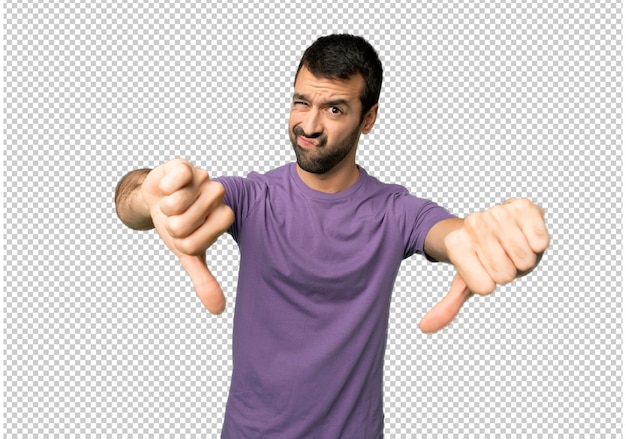 Handsome man showing thumb down with both hands