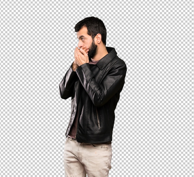 PSD handsome man with beard covering mouth and looking to the side