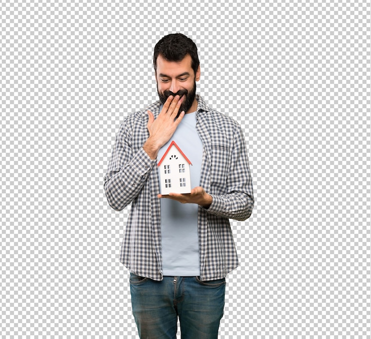 PSD handsome man with beard holding a little house