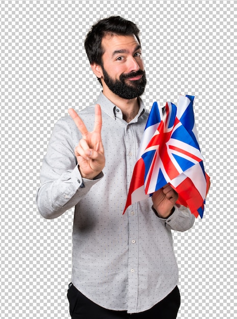 Handsome man with beard holding many flags and counting two